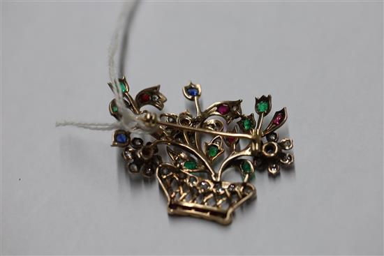 An early 20th century gold and multi gem set guiardinetto (flowers in a basket) brooch, gross 9.9 grams.